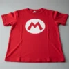 D_NQ_NP_2X_897559-MLB114382759843_072026-F-camiseta-infantil-mario-bros-1-pc- Camiseta Manga Curta Unissex Infantil Mário Bros Logo M Vermelho