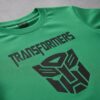 D_NQ_NP_2X_954102-MLA113191279598_072026-F Camiseta Manga Curta Malha PV Infantil Unissex Verde Transformers Estampa Silk Screen Manual Premium